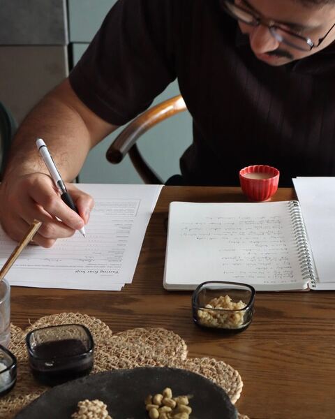 A guest taking tasting notes