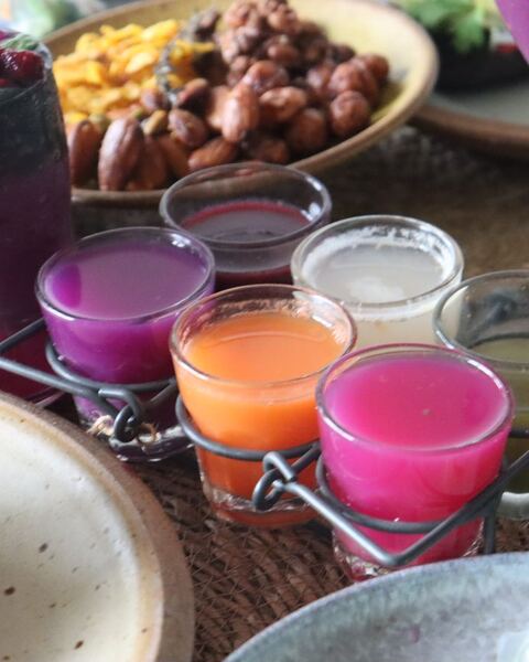 Colourful smoothies in small glasses