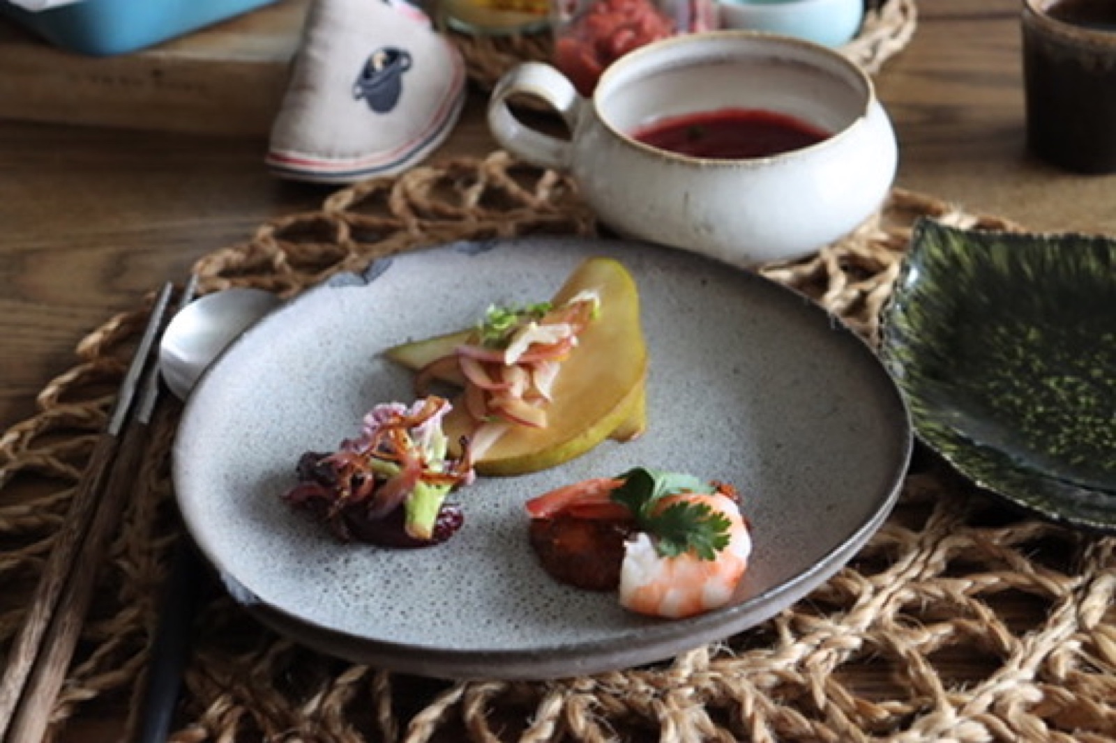 A plate of fermented dishes from the final day: pear with koji, octopus and a prawn