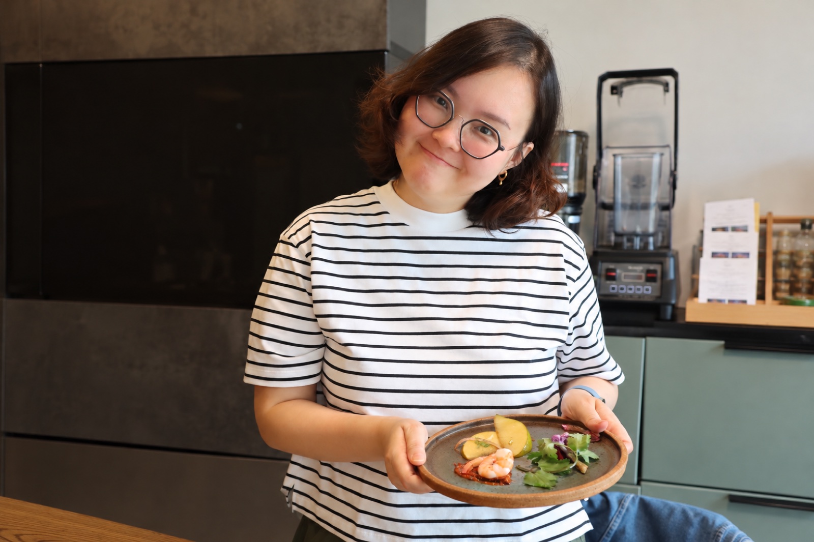 Joy holding the plate she arranged